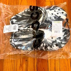 Brand new with tags black and white mens crocs.